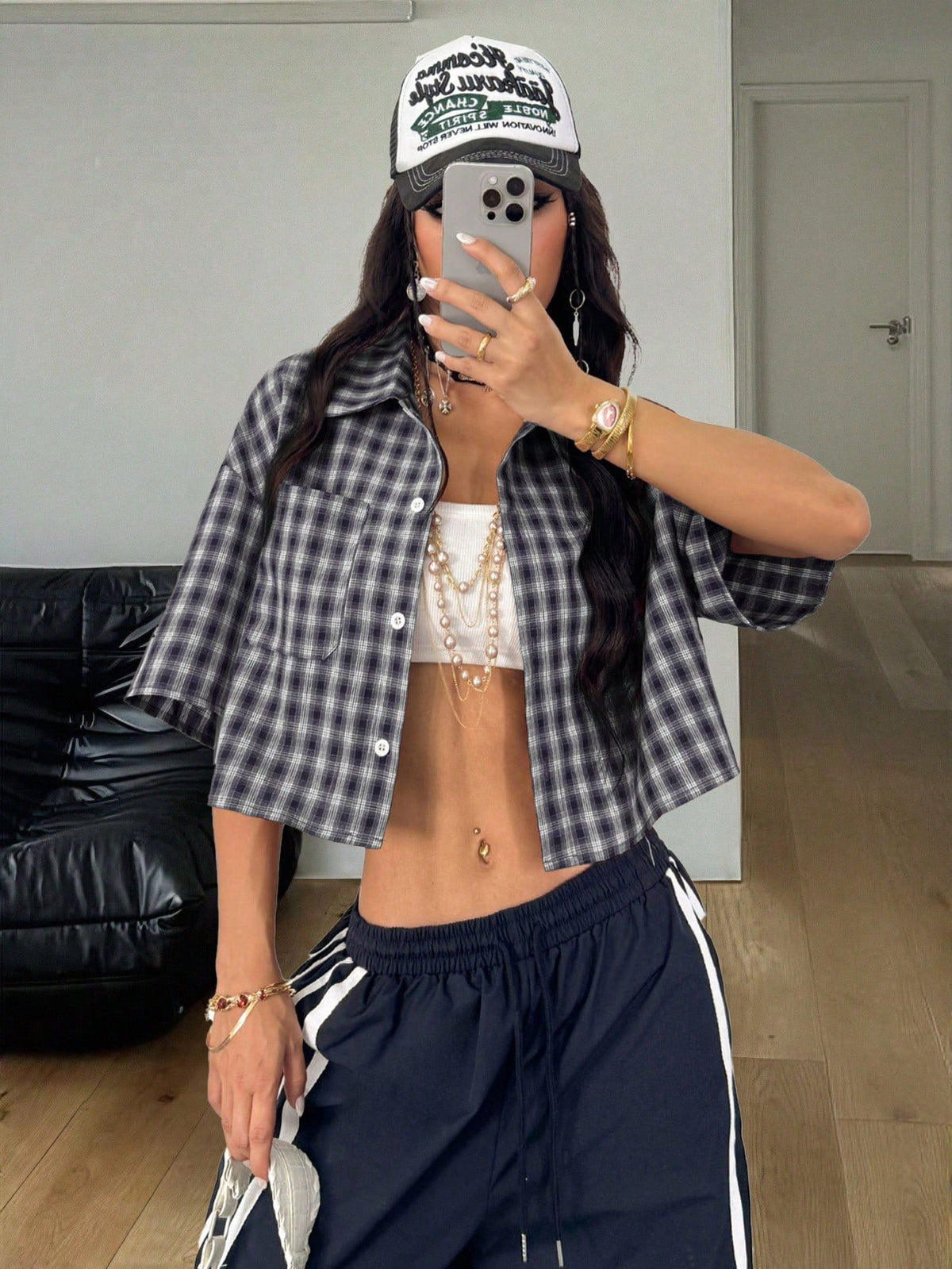 Women's plaid crop shirt with button front, chest pocket, short sleeves, and loose casual fit.