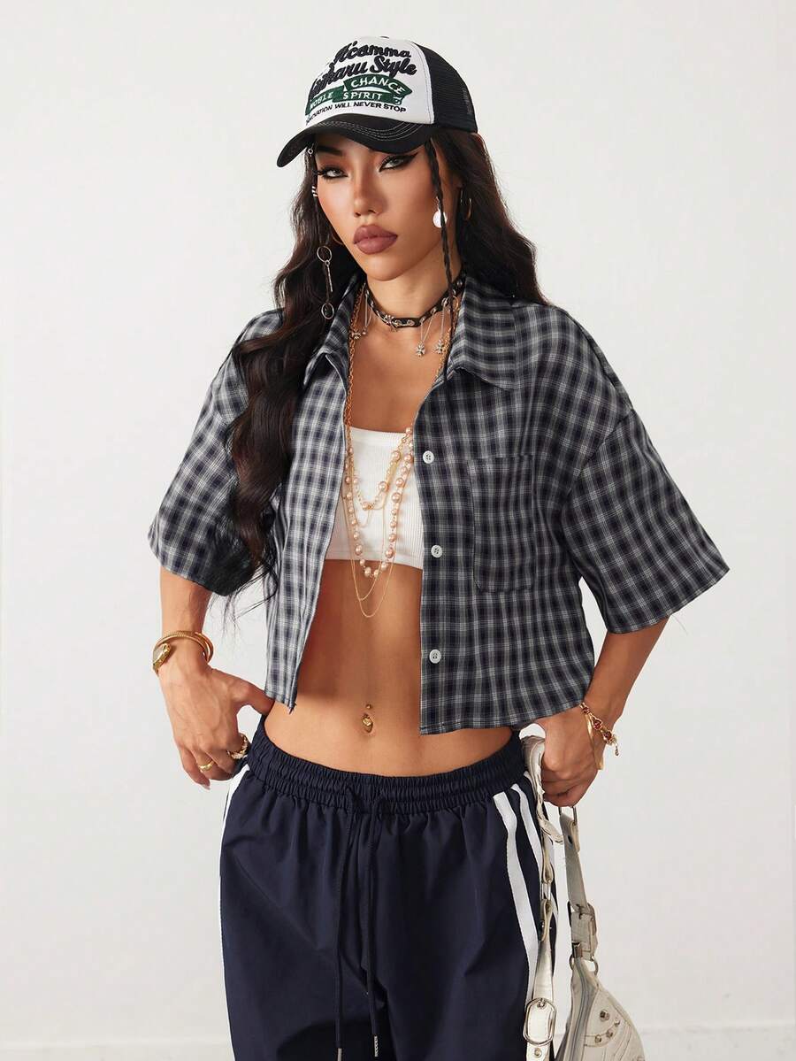 Women's plaid crop shirt with button front, chest pocket, short sleeves, and loose casual fit.