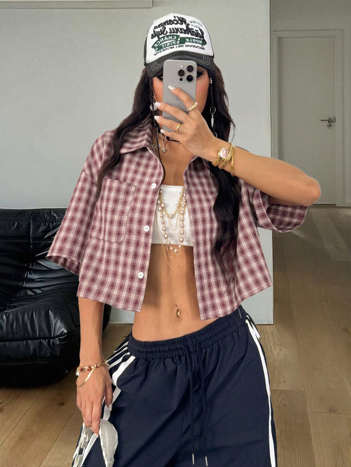 Women's plaid crop shirt with button front, chest pocket, short sleeves, and loose casual fit.
