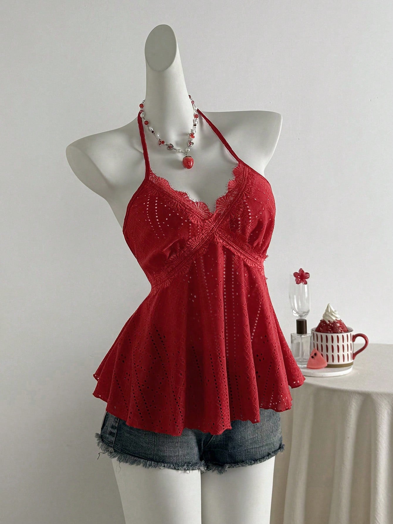 Women's halter crop camisole with textured detail, slim fit, and flared hem for beach vacation and spring or summer wear