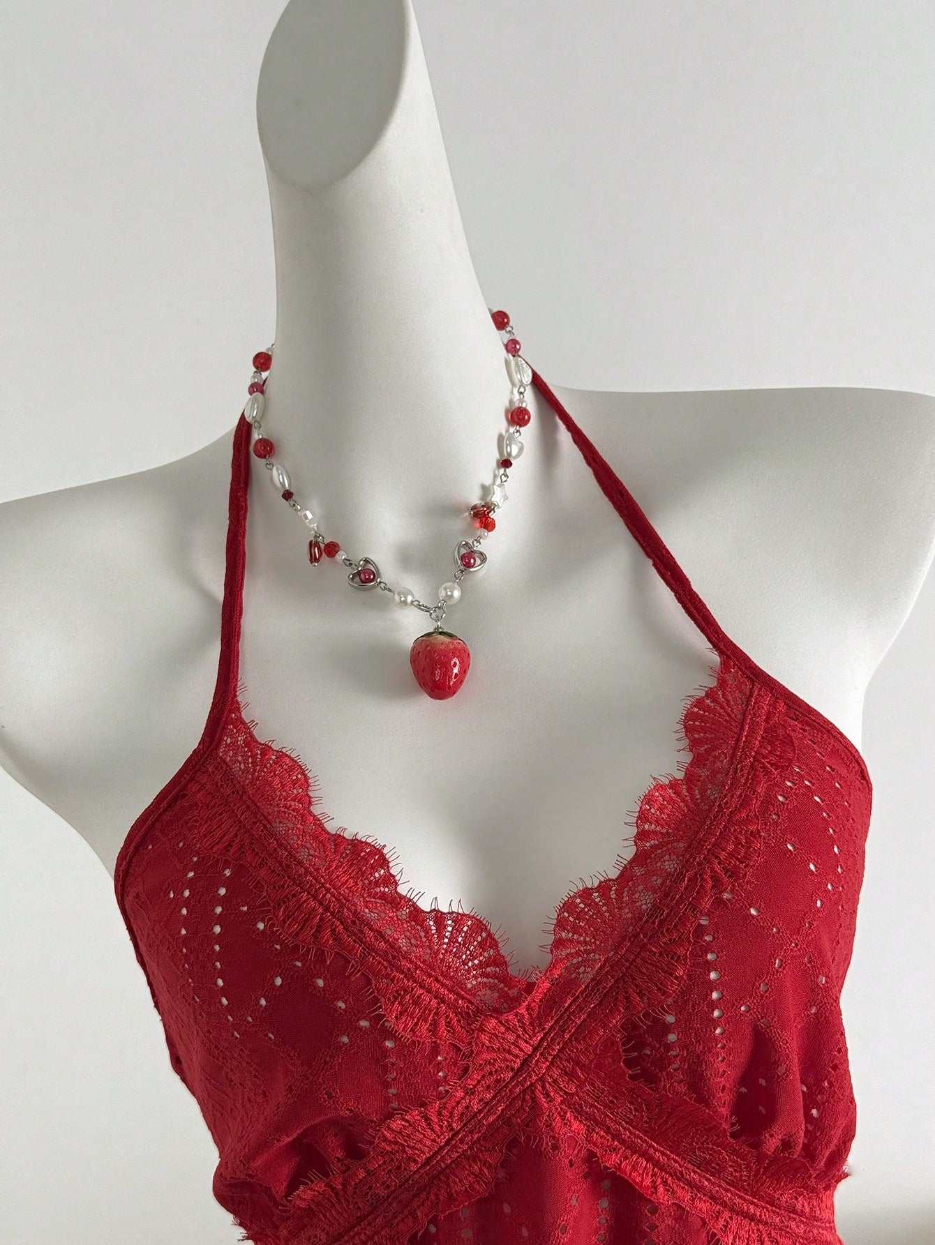 Women's halter crop camisole with textured detail, slim fit, and flared hem for beach vacation and spring or summer wear