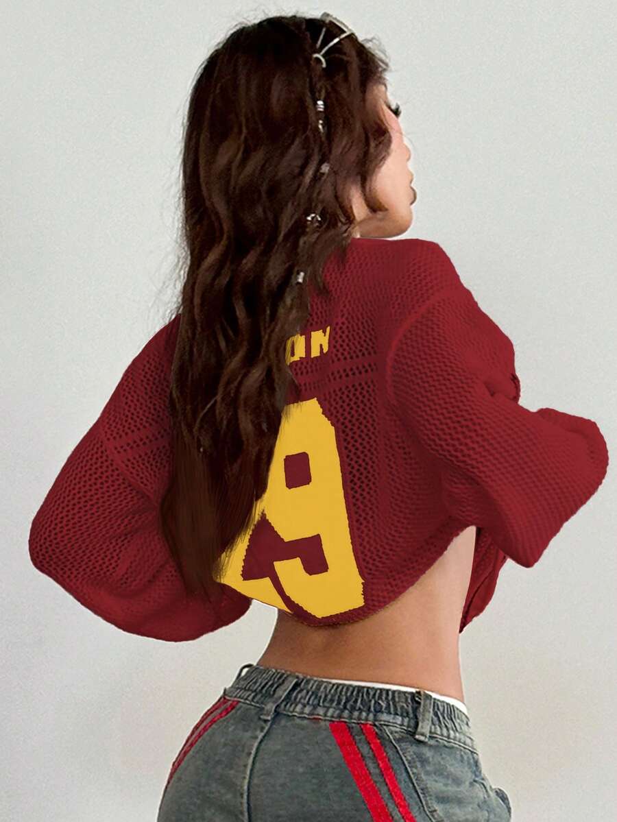 Women's oversized long sleeve knit pullover sweater with round neck, drop shoulder design, and front pocket detail.
