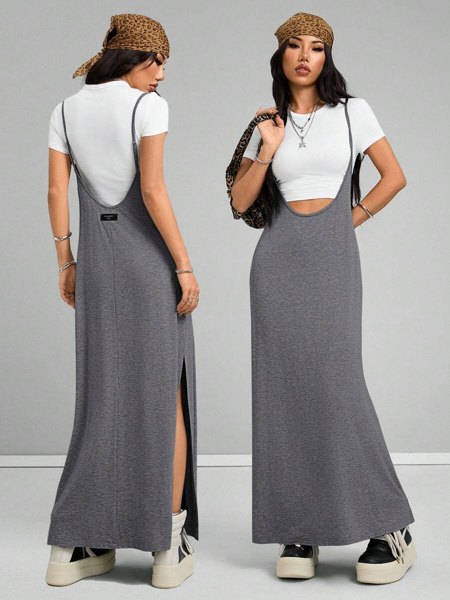 Sleeveless black cami maxi dress with spaghetti straps, textured knitted fabric, and a high thigh slit for women.