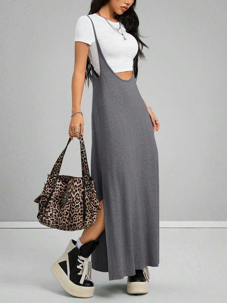Sleeveless black cami maxi dress with spaghetti straps, textured knitted fabric, and a high thigh slit for women.
