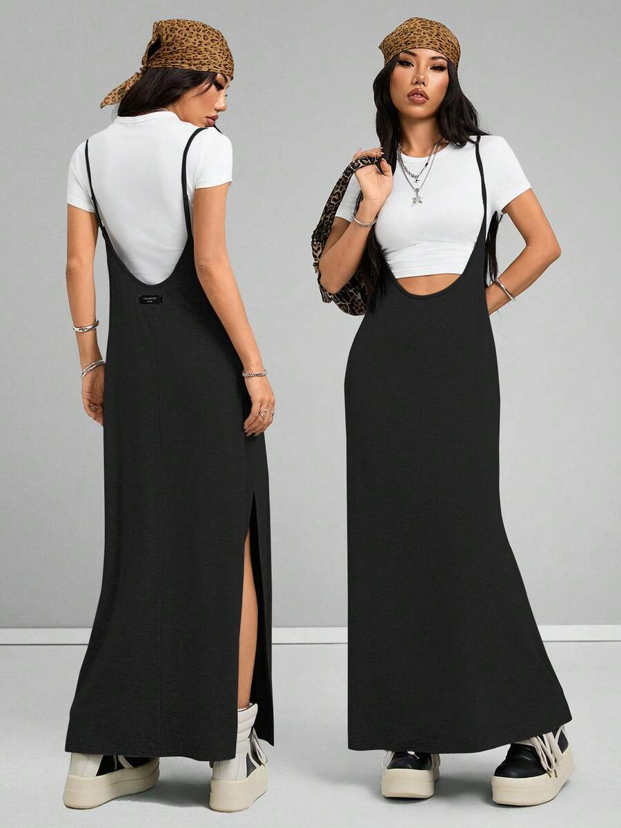 Sleeveless black cami maxi dress with spaghetti straps, textured knitted fabric, and a high thigh slit for women.