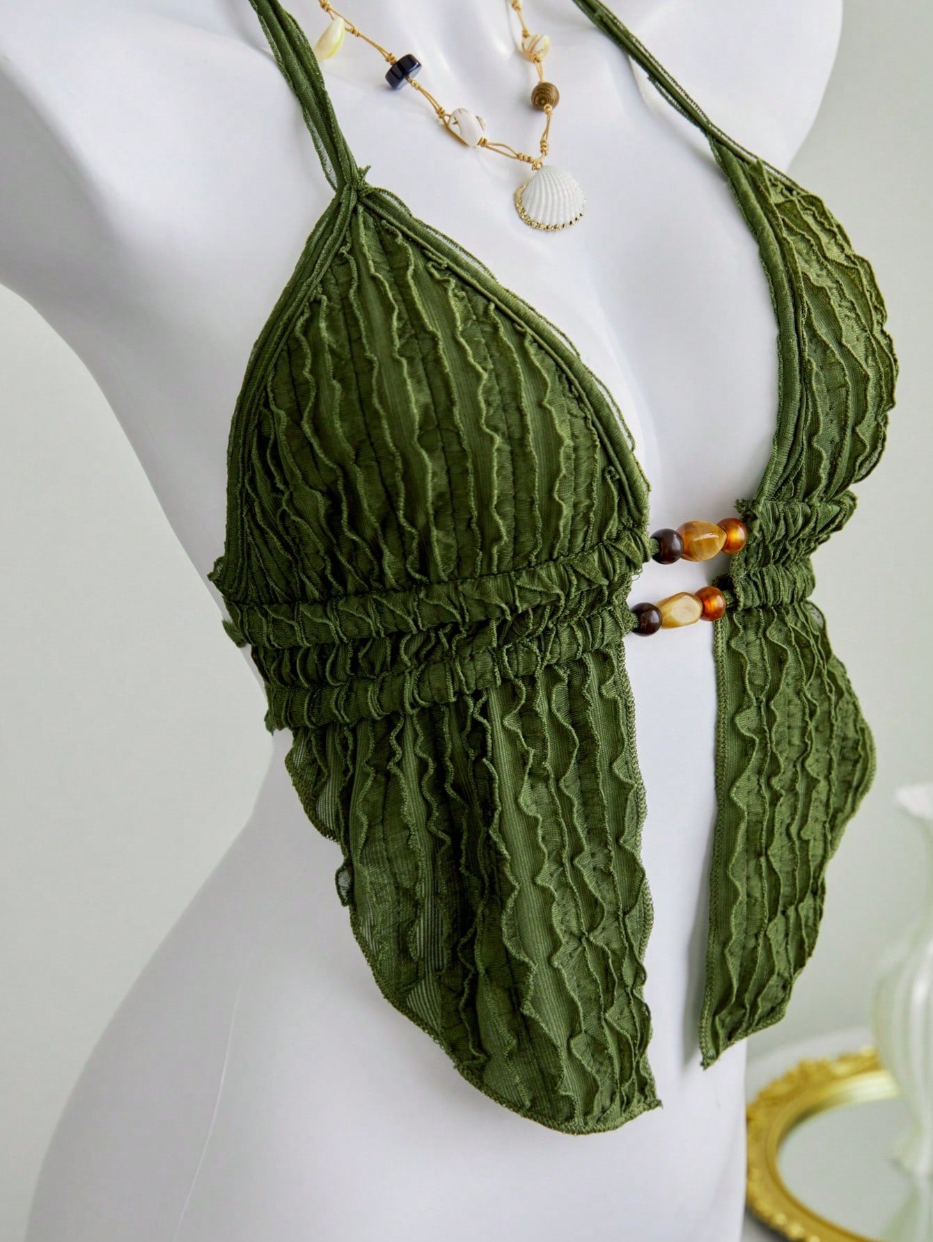 Women's textured halter camisole with pearl bead details, backless styling, asymmetrical hem, and micro crop slim fit