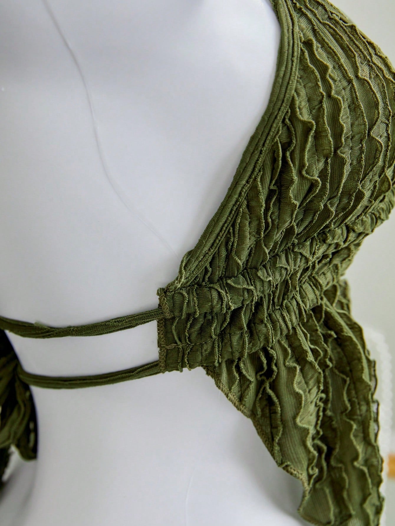 Women's textured halter camisole with pearl bead details, backless styling, asymmetrical hem, and micro crop slim fit