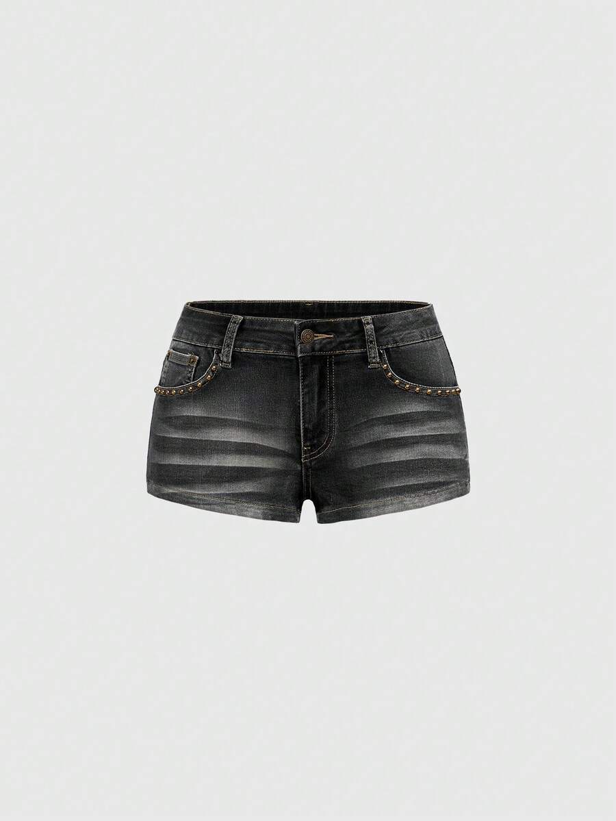 Women's Y2K low waist distressed shorts featuring butterfly studded details, pockets, and a zipper fly closure.