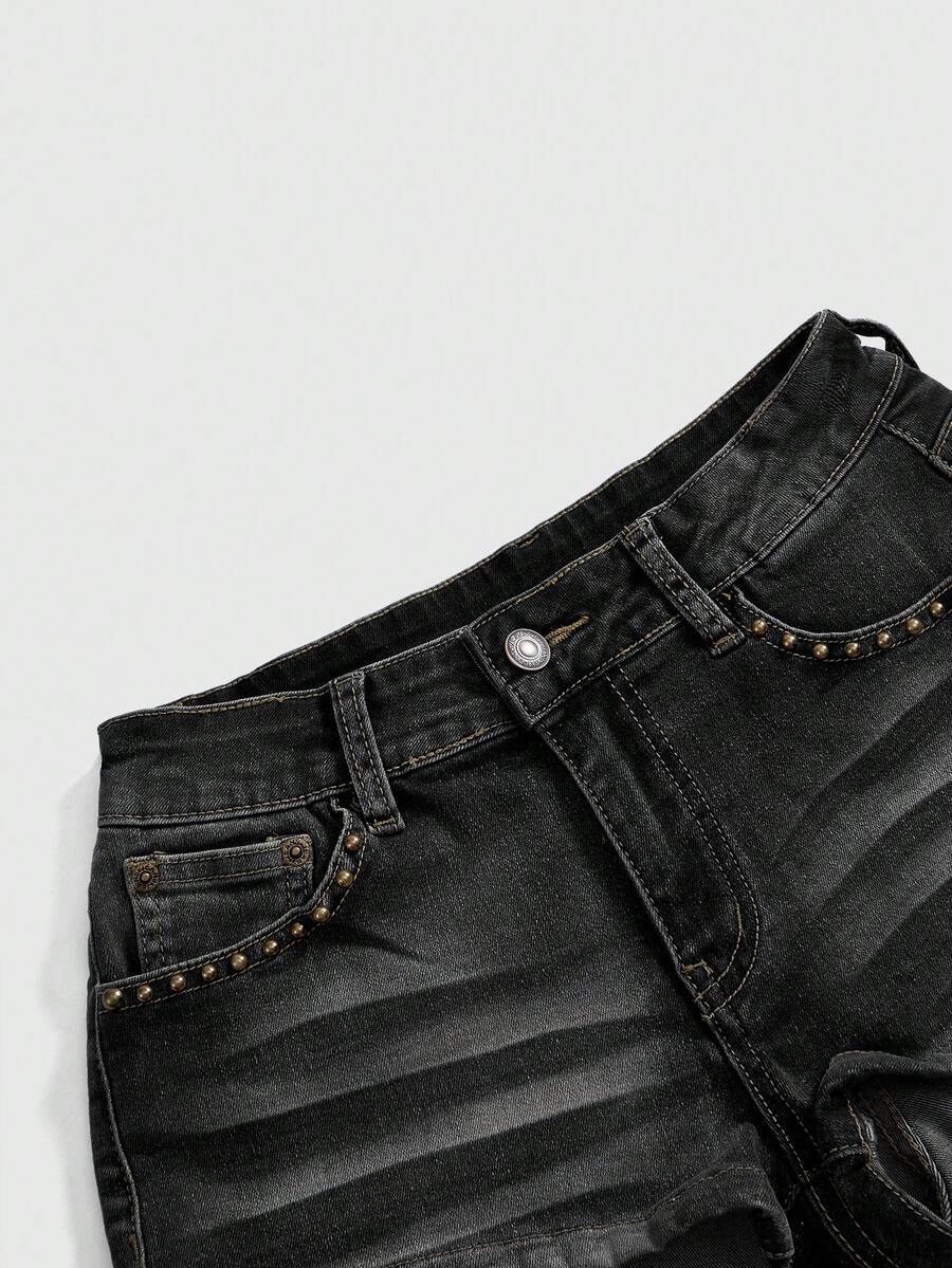 Women's Y2K low waist distressed shorts featuring butterfly studded details, pockets, and a zipper fly closure.
