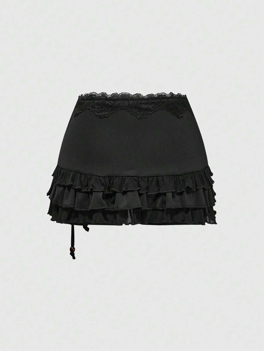 Women's low-waist leopard print mini skirt with drawstring tie-up, ruched detail, layered ruffle hem, and asymmetric grunge punk styling
