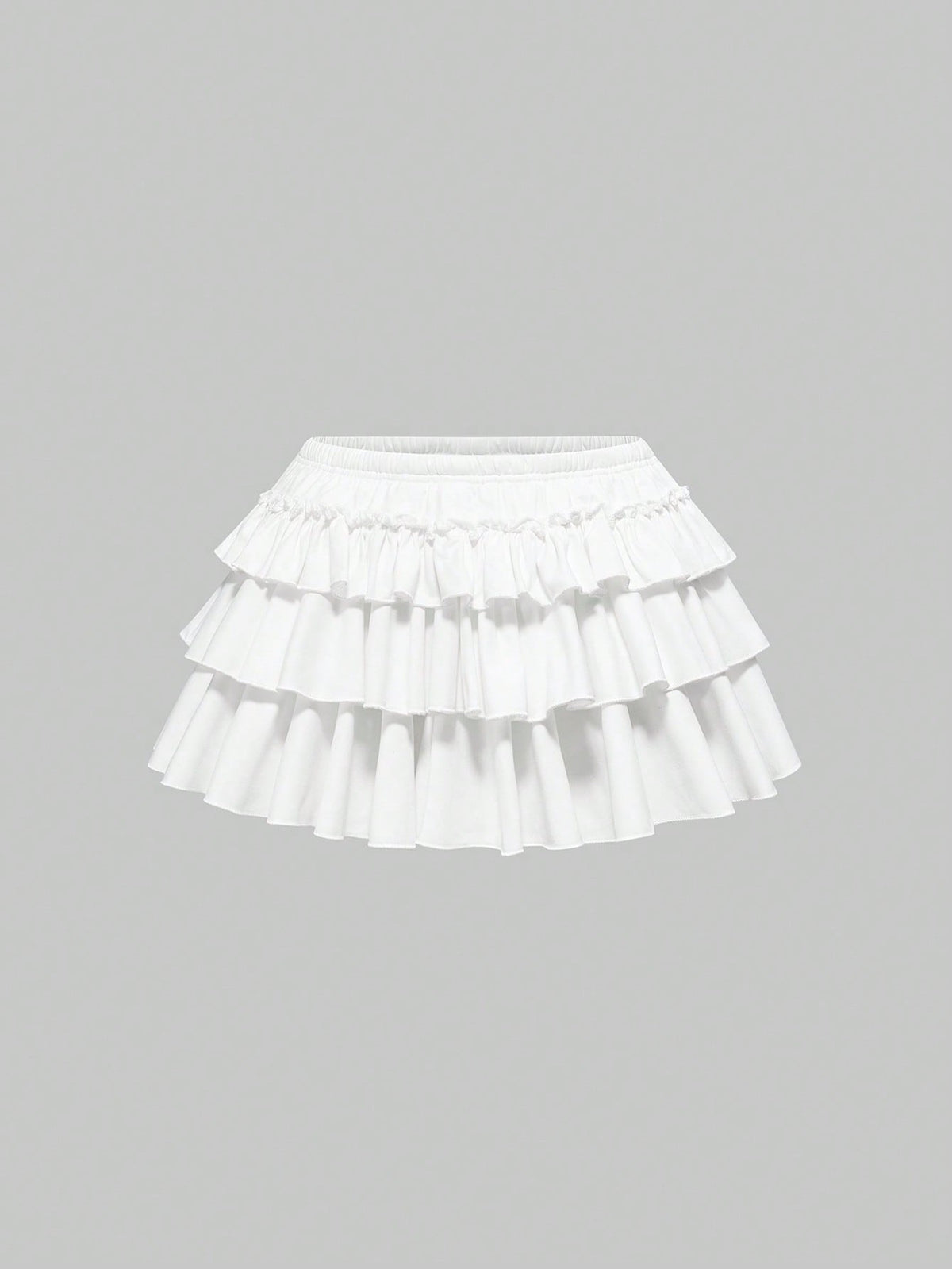 Women's low waist tiered mini skirt featuring ruffled hem layers in knitted stretch fabric.