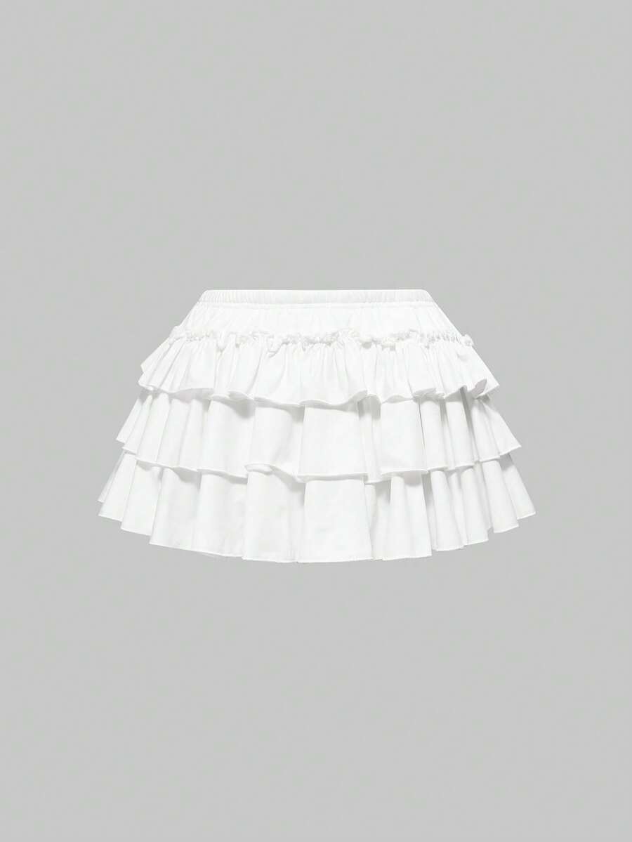 Women's low waist tiered mini skirt featuring ruffled hem layers in knitted stretch fabric.