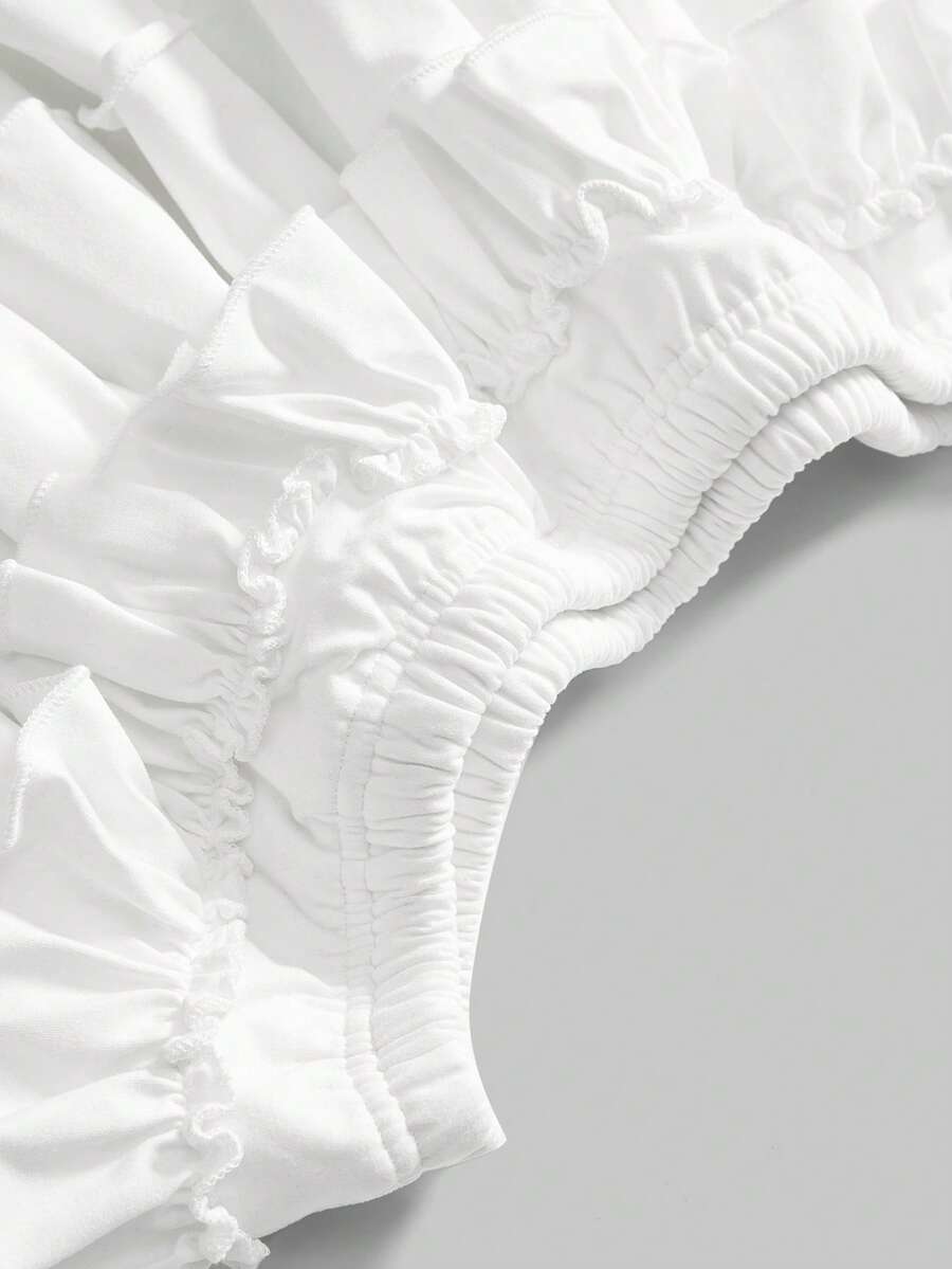 Women's low waist tiered mini skirt featuring ruffled hem layers in knitted stretch fabric.