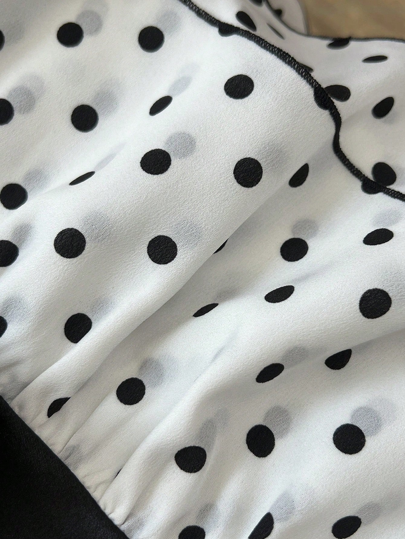 Women's polka dot camisole top with contrast lace trim, tank vest neckline, slim fit, and flared ruffle hem.
