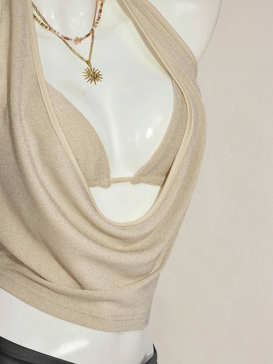 Women's glitter halter backless micro crop tank top featuring a draped knot front design.