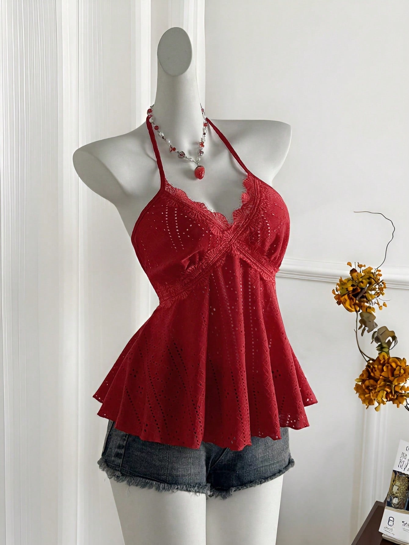 Women's halter crop camisole with textured detail, slim fit, and flared hem for beach vacation and spring or summer wear