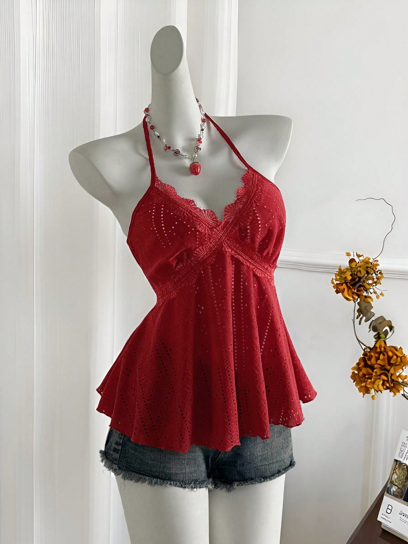 Women's halter crop camisole with textured detail, slim fit, and flared hem for beach vacation and spring or summer wear