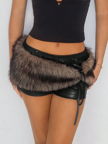 Women's brown low waist PU mini shorts with contrast faux fur panel, knot detail, zipper detail, and elastic waistband
