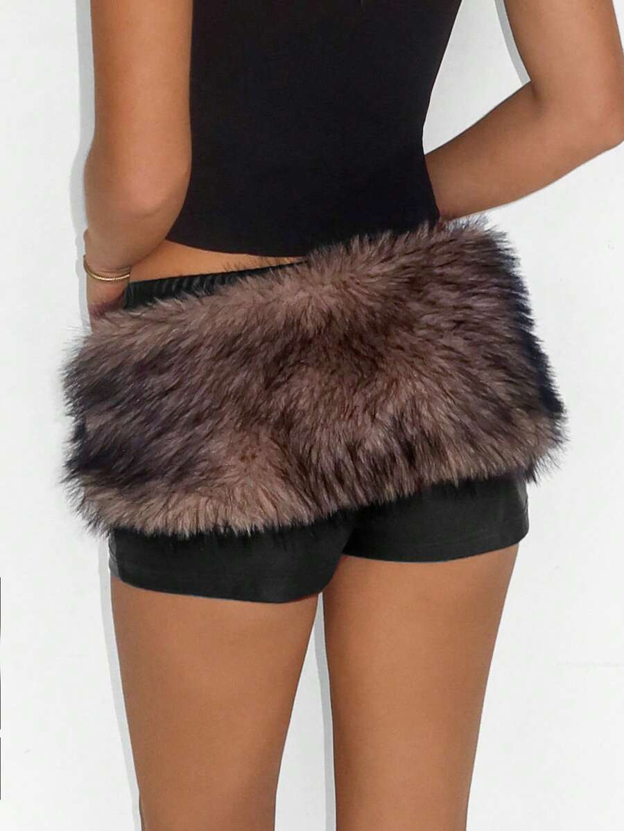 Women's brown low waist PU mini shorts with contrast faux fur panel, knot detail, zipper detail, and elastic waistband