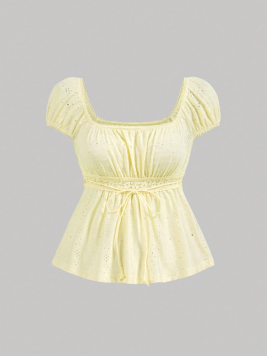 Yellow short puff sleeve tee featuring a square neckline, ruched bust with knot detail, eyelet embroidery, and a gathered waist.