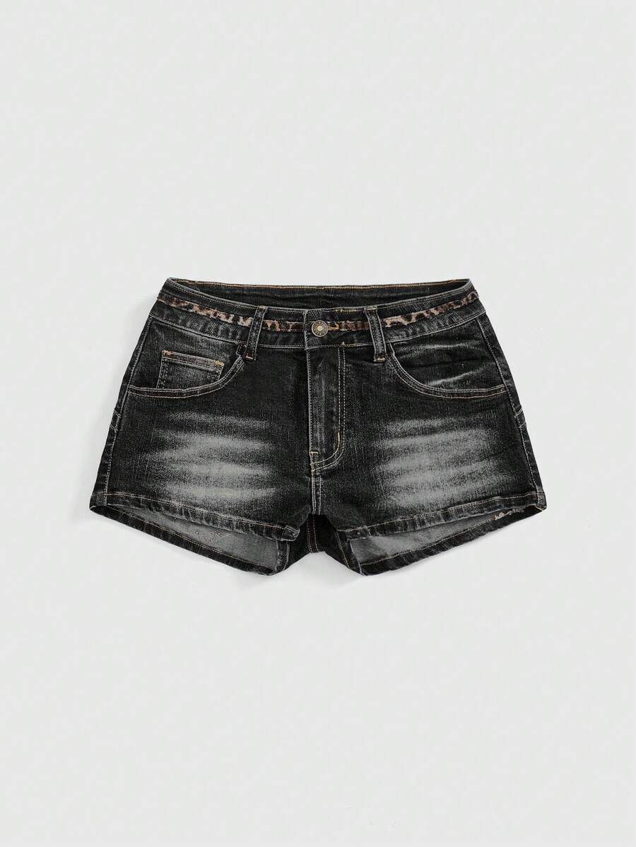 Women's super low waist shorts with leopard print embroidery, button and zipper closure, and raw hem detailing.