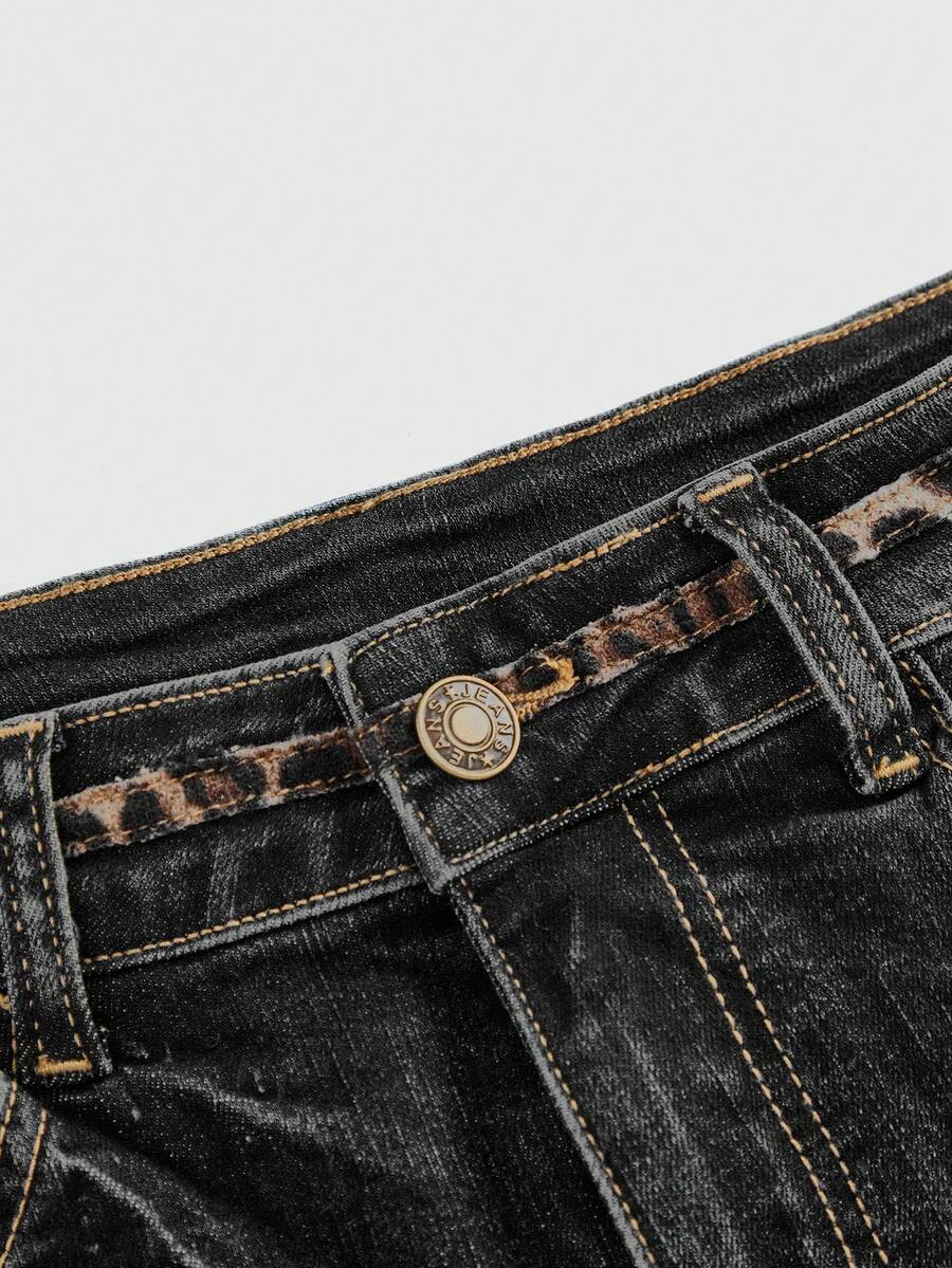 Women's super low waist shorts with leopard print embroidery, button and zipper closure, and raw hem detailing.