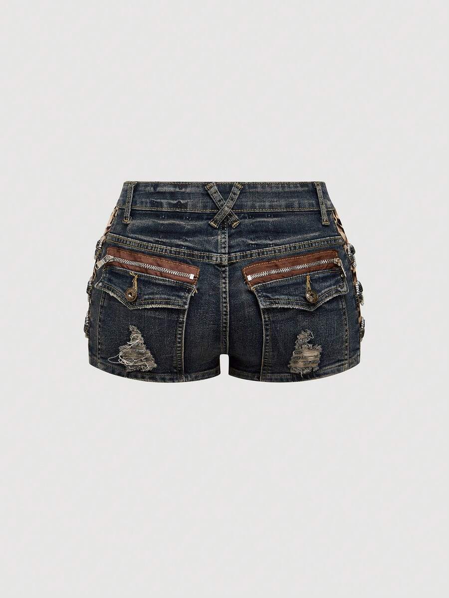 Women's ultra low waist vintage Y2K leopard print skinny mini shorts featuring ripped details, button, and zipper fly.