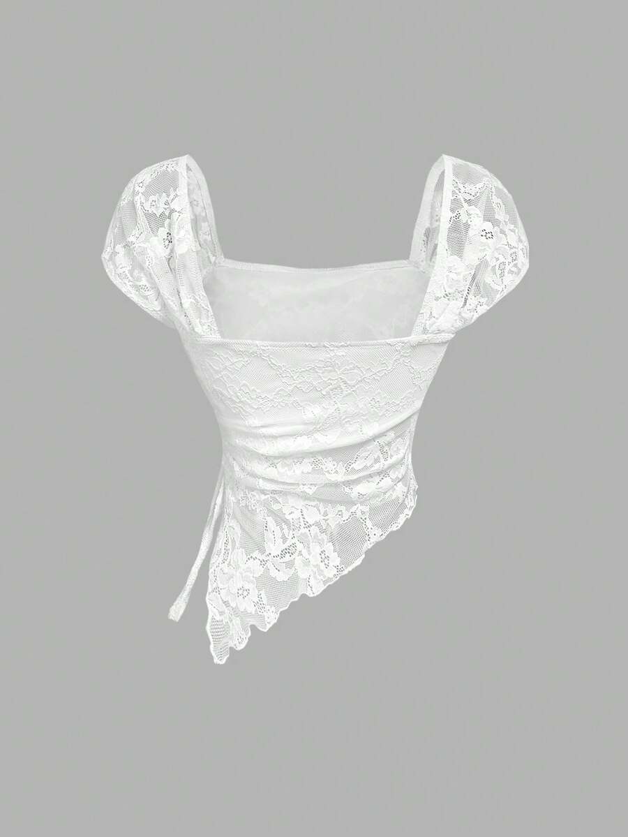 Women's white asymmetrical ruched lace top featuring drawstring details, square neckline, and cap sleeves.