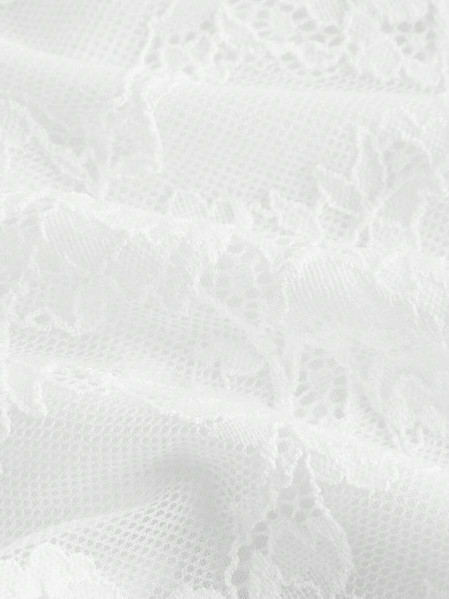 Women's white asymmetrical ruched lace top featuring drawstring details, square neckline, and cap sleeves.