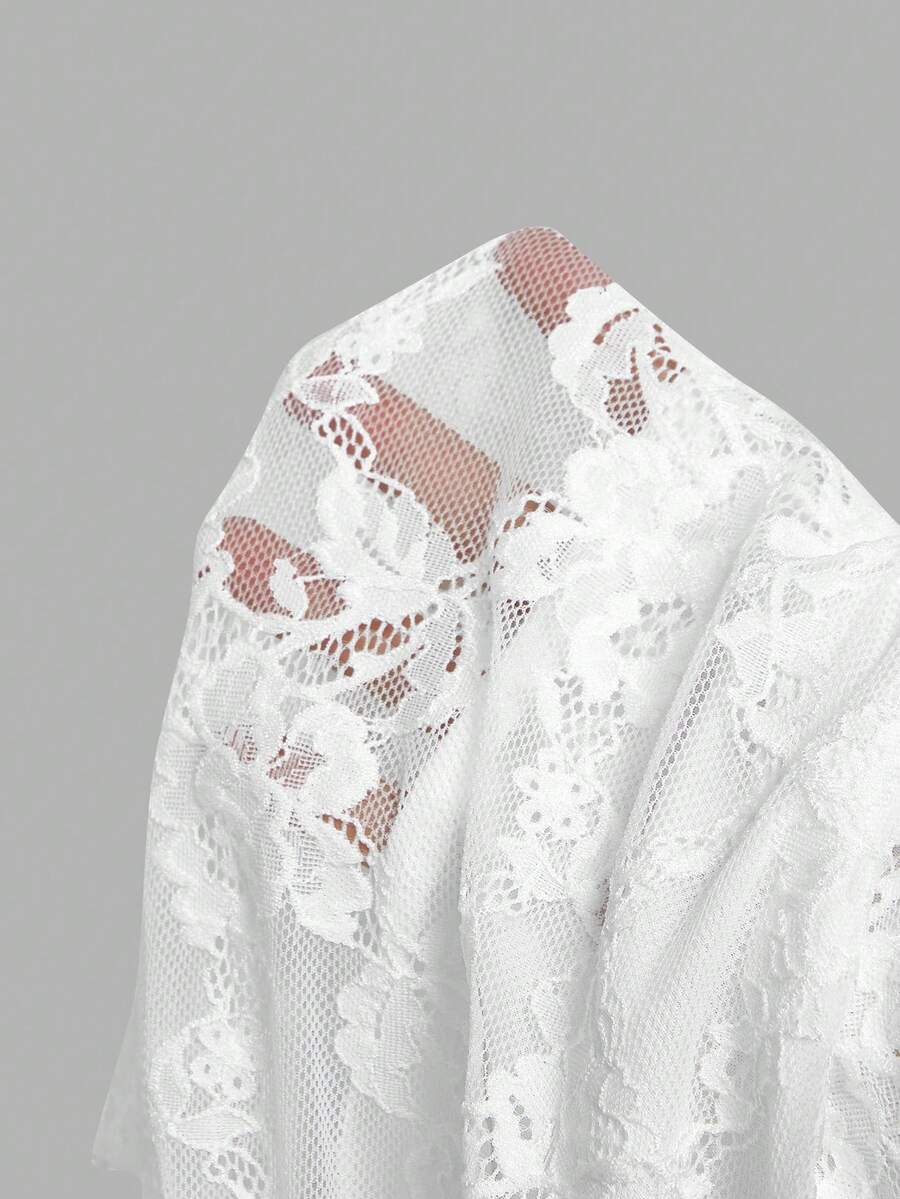 Women's white asymmetrical ruched lace top featuring drawstring details, square neckline, and cap sleeves.