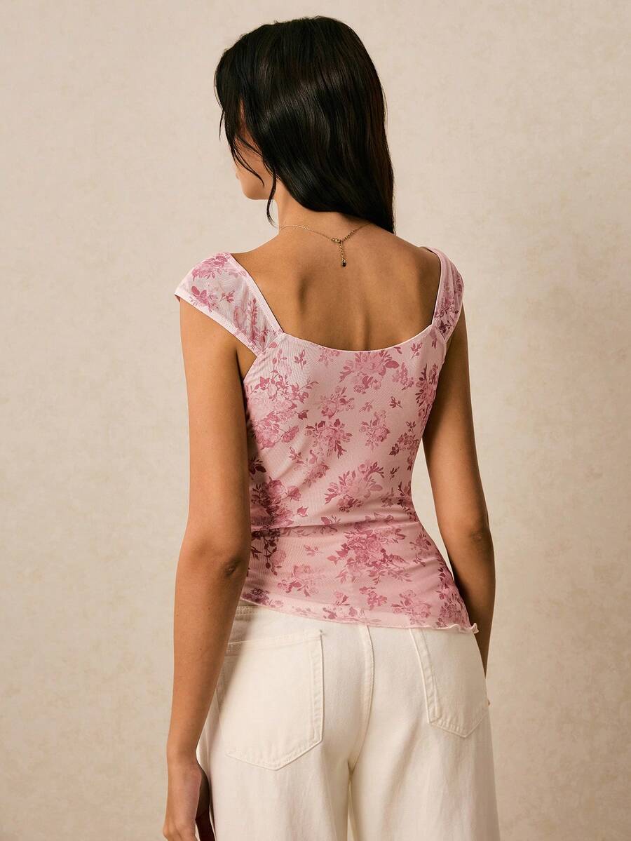 Women's dusty pink floral print mesh tank top featuring a square neckline, ruched bust with a tie-front knot, and an asymmetrical hem.