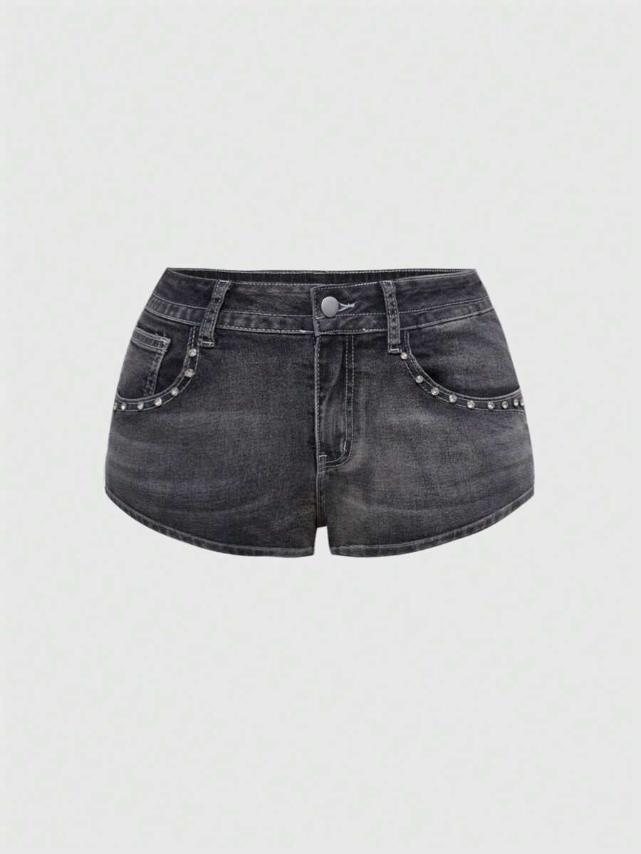 Women's ultra low waist skort with mini shorts length, zipper fly, pockets, pistol embroidery, and rhinestone details