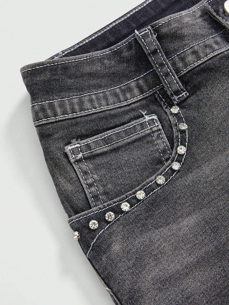 Women's ultra low waist skort with mini shorts length, zipper fly, pockets, pistol embroidery, and rhinestone details