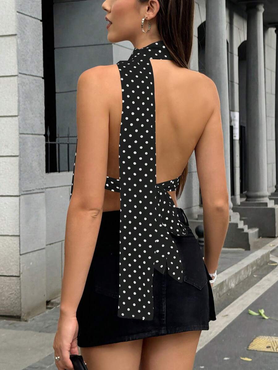 Women's polka dot halter tank top featuring neck straps, a backless tie-back design, regular hem, loose fit, and woven polyester fabric.