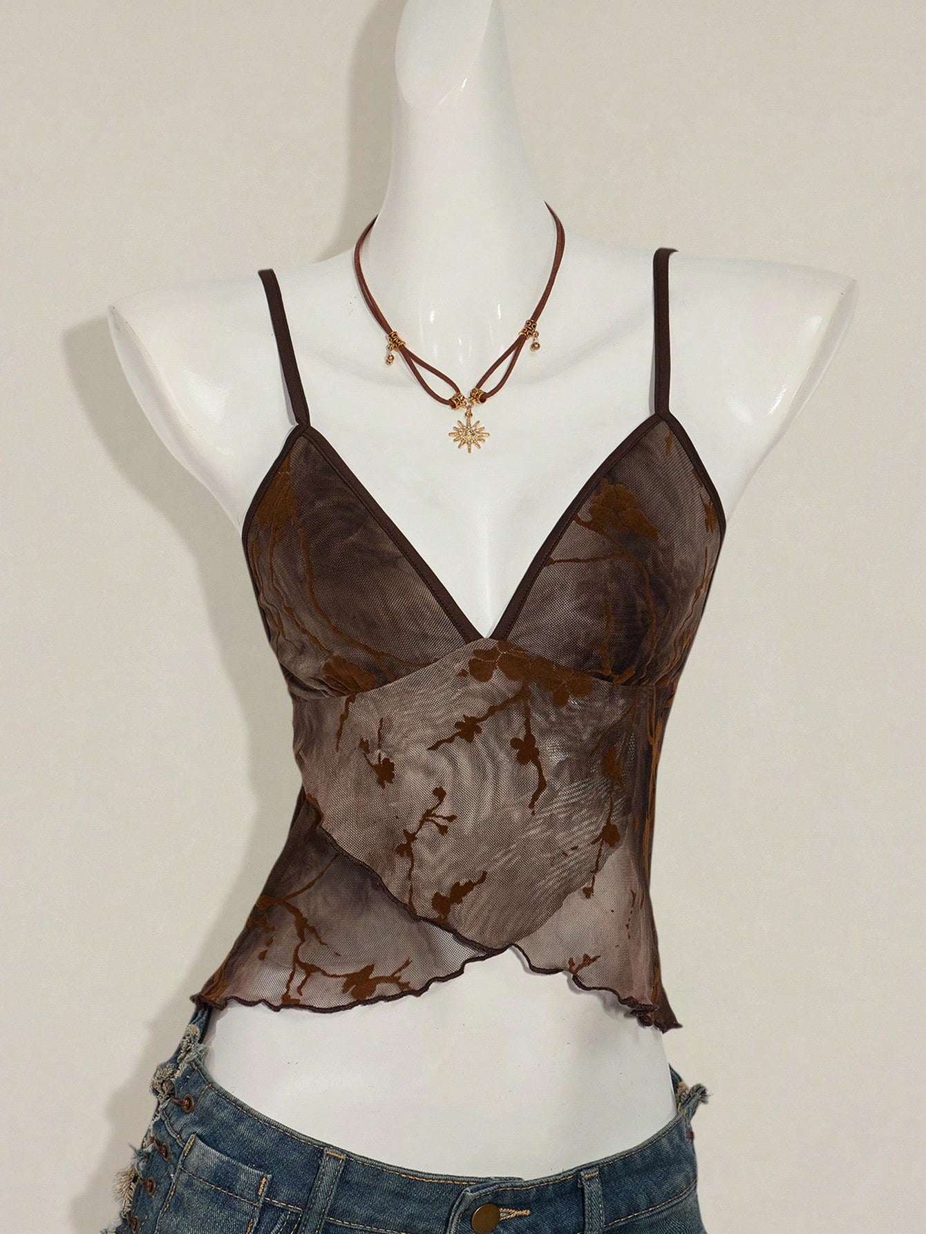 Women's cropped floral flocked camisole with spaghetti straps, backless styling, lettuce trim, asymmetrical hem, and slim fit
