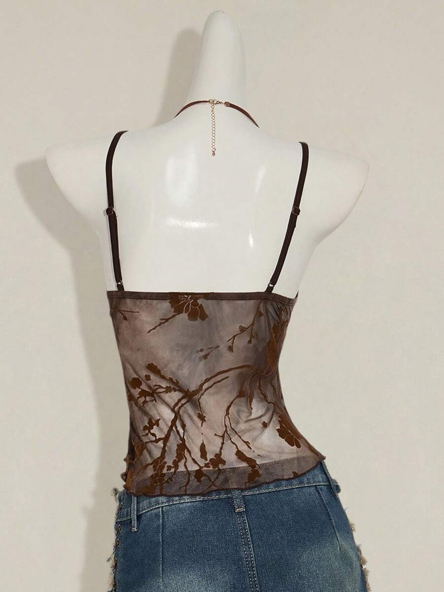Women's cropped floral flocked camisole with spaghetti straps, backless styling, lettuce trim, asymmetrical hem, and slim fit