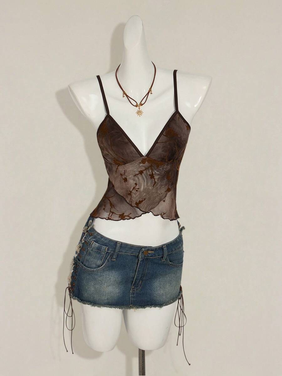 Women's cropped floral flocked camisole with spaghetti straps, backless styling, lettuce trim, asymmetrical hem, and slim fit