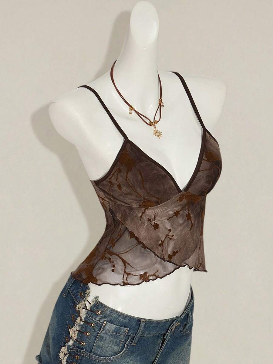 Women's cropped floral flocked camisole with spaghetti straps, backless styling, lettuce trim, asymmetrical hem, and slim fit