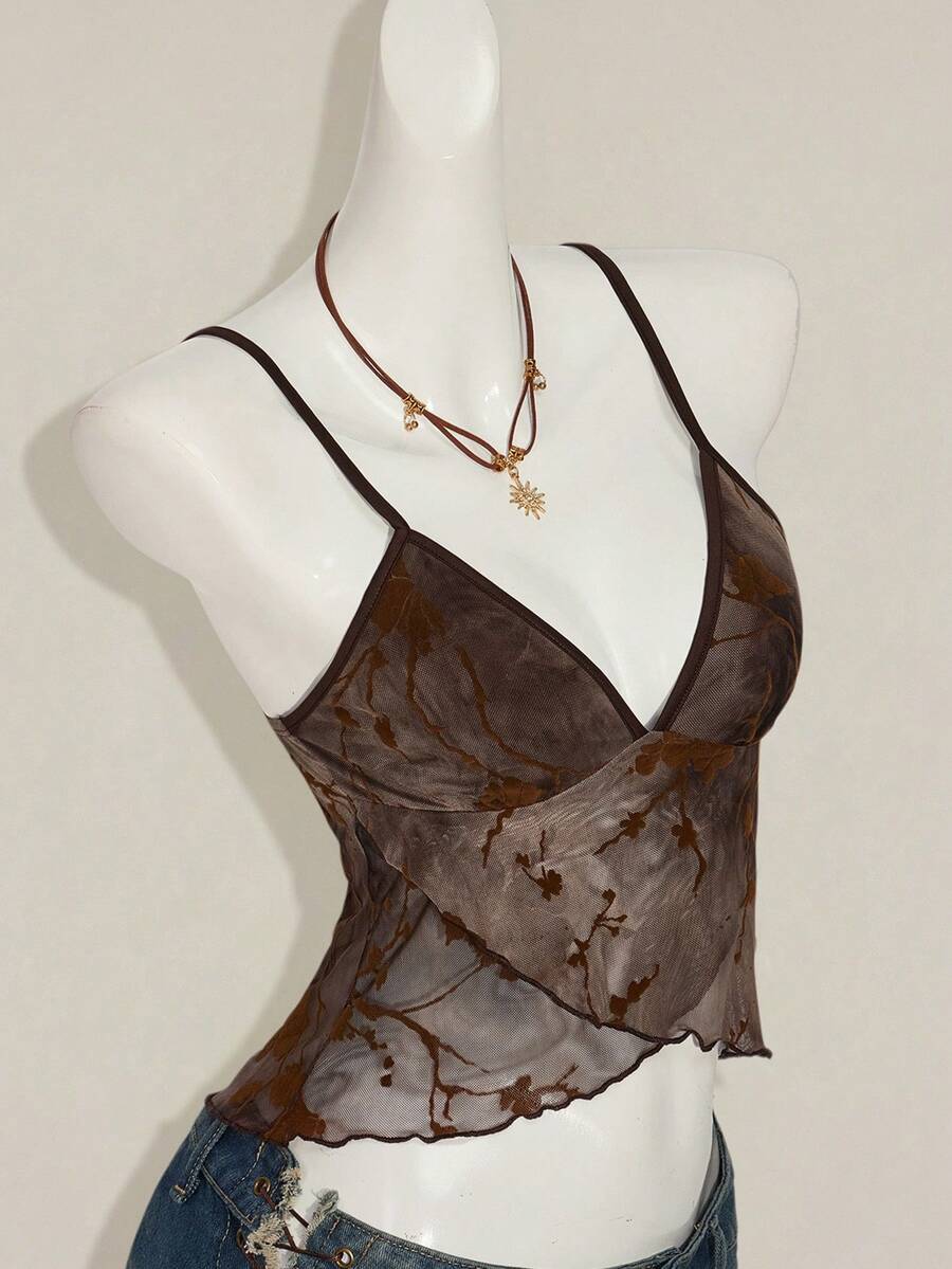 Women's cropped floral flocked camisole with spaghetti straps, backless styling, lettuce trim, asymmetrical hem, and slim fit