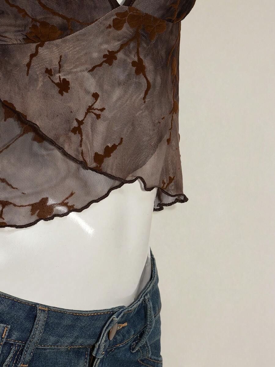 Women's cropped floral flocked camisole with spaghetti straps, backless styling, lettuce trim, asymmetrical hem, and slim fit