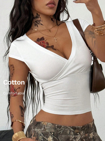 Women's slim fit V-neck short sleeve crop t-shirt featuring ruched wrap detailing in stretch knit fabric.