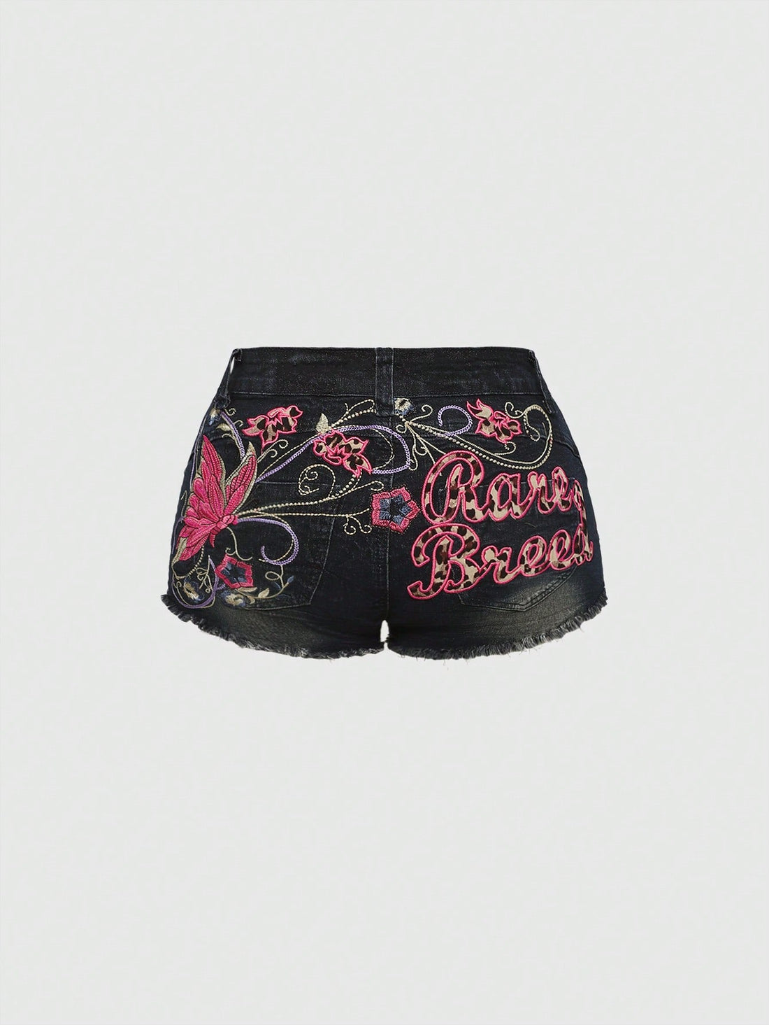 Blue Y2K low waist shorts with butterfly embroidery, distressed washed finish, raw hem, button detail, and zipper fly closure.
