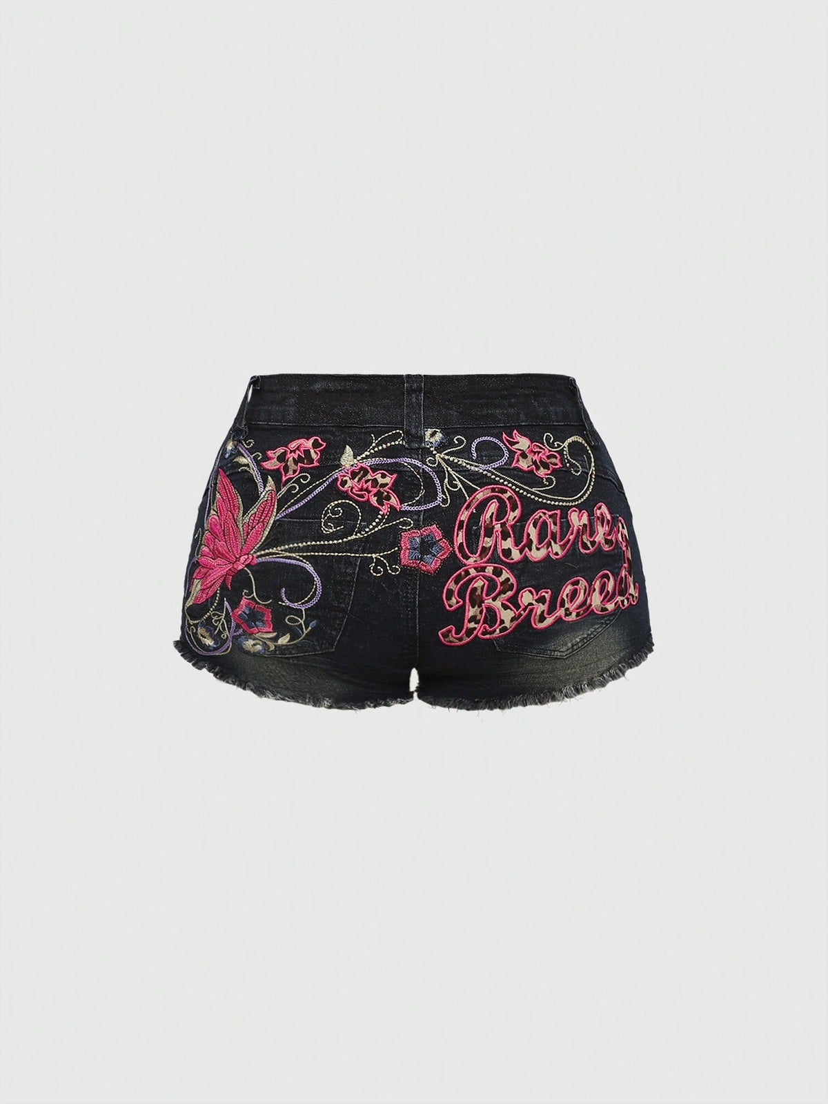 Blue Y2K low waist shorts with butterfly embroidery, distressed washed finish, raw hem, button detail, and zipper fly closure.