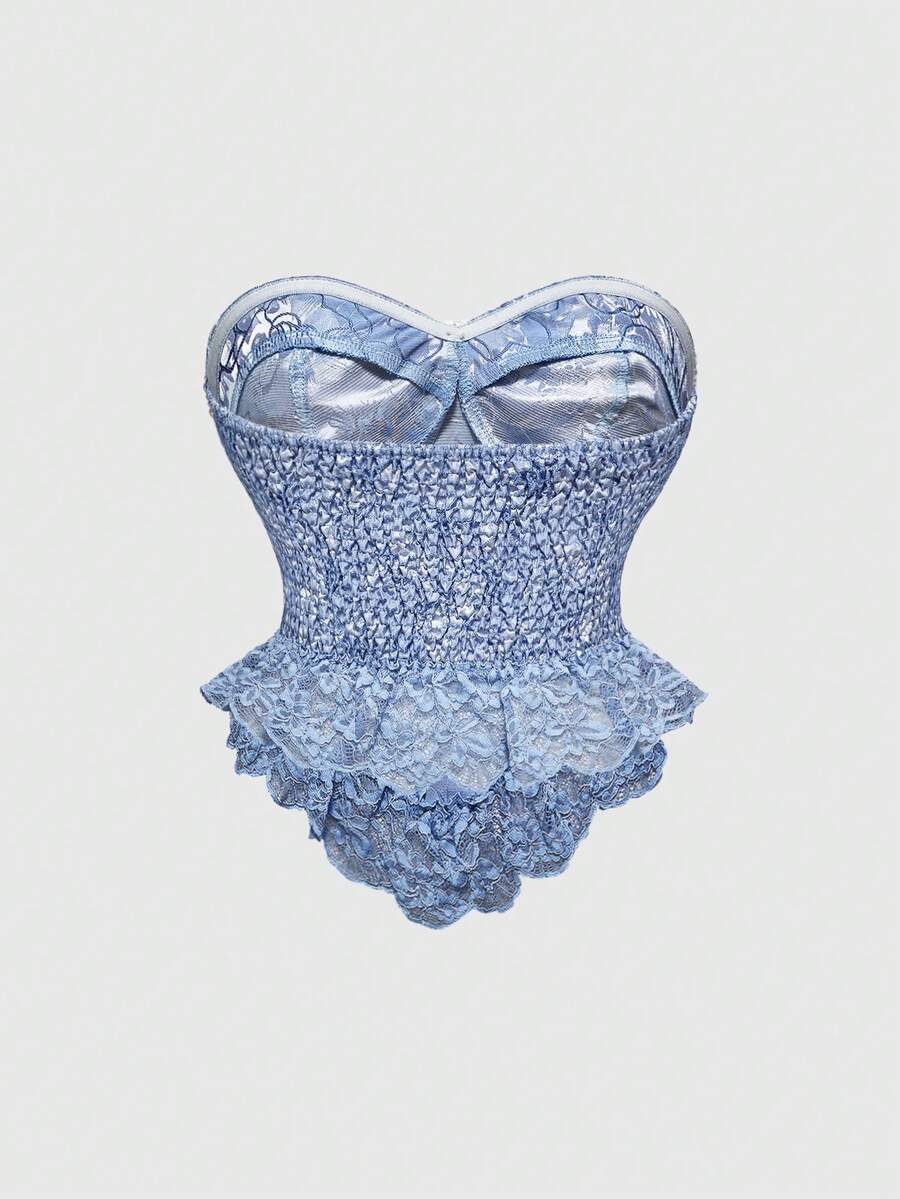Women's apricot strapless vintage palace style blouse featuring an asymmetrical ruffle hem, backless design, and pearl brooch detail.