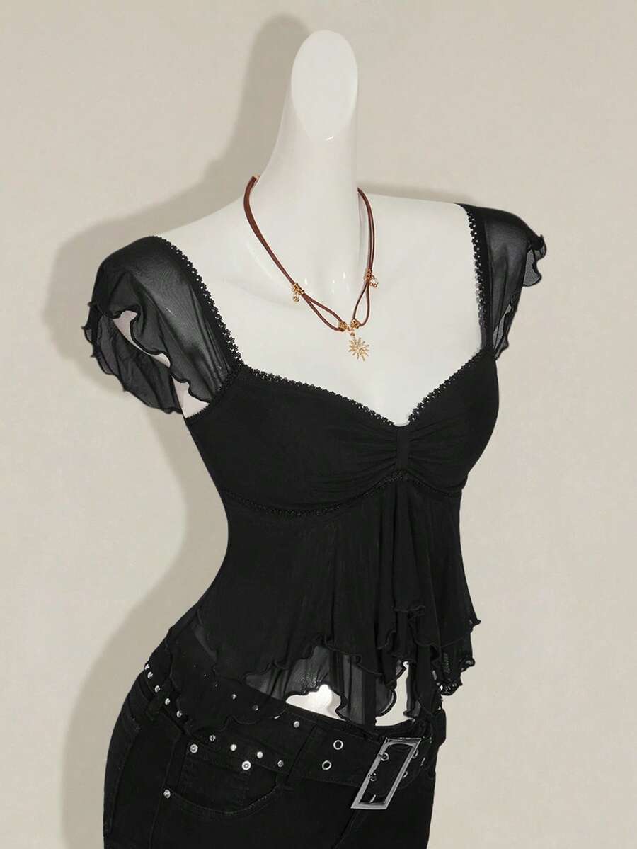 Black slim fit women's ruched front camisole tank top featuring contrast mesh inserts, square neckline, and an asymmetrical crop hem.