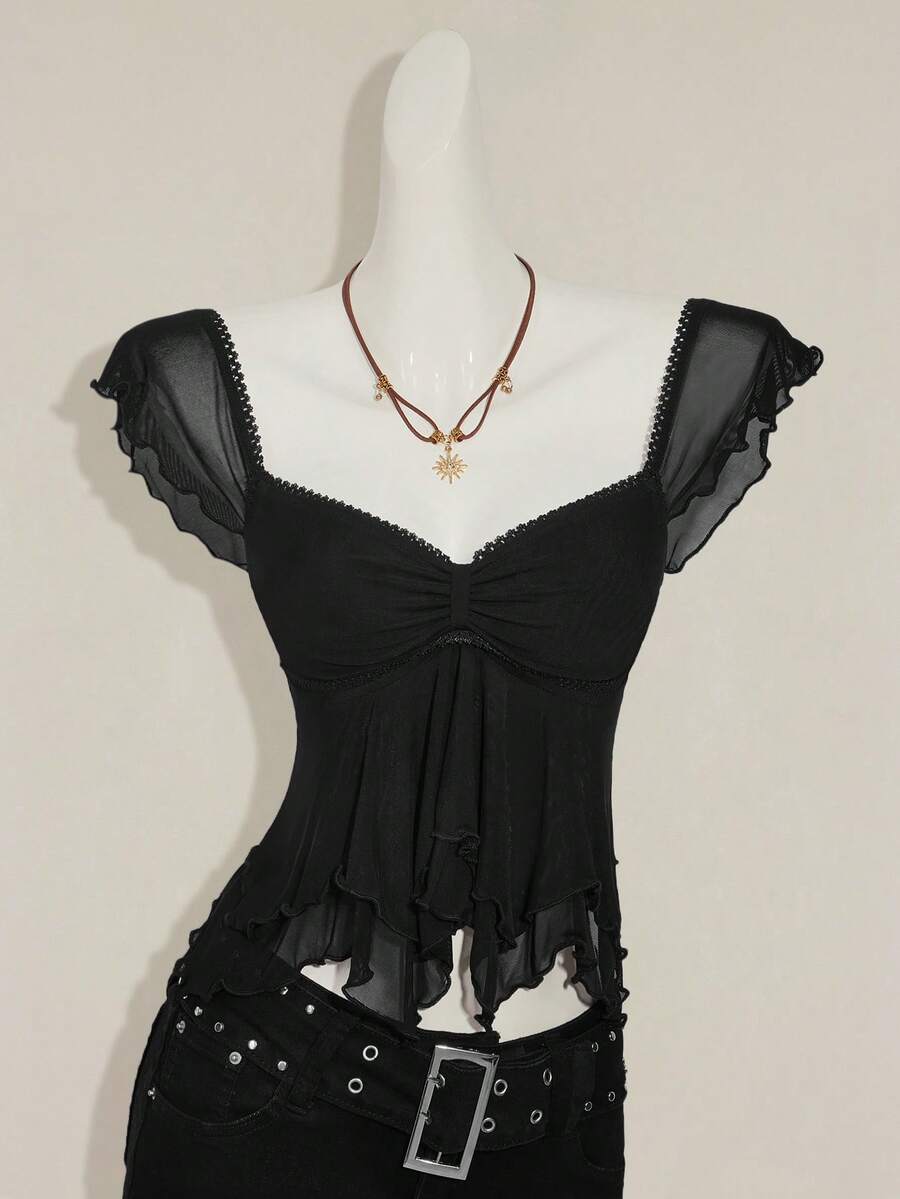 Black slim fit women's ruched front camisole tank top featuring contrast mesh inserts, square neckline, and an asymmetrical crop hem.