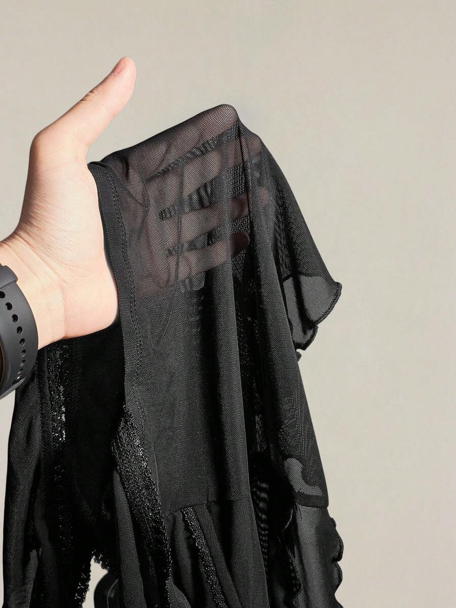 Black slim fit women's ruched front camisole tank top featuring contrast mesh inserts, square neckline, and an asymmetrical crop hem.