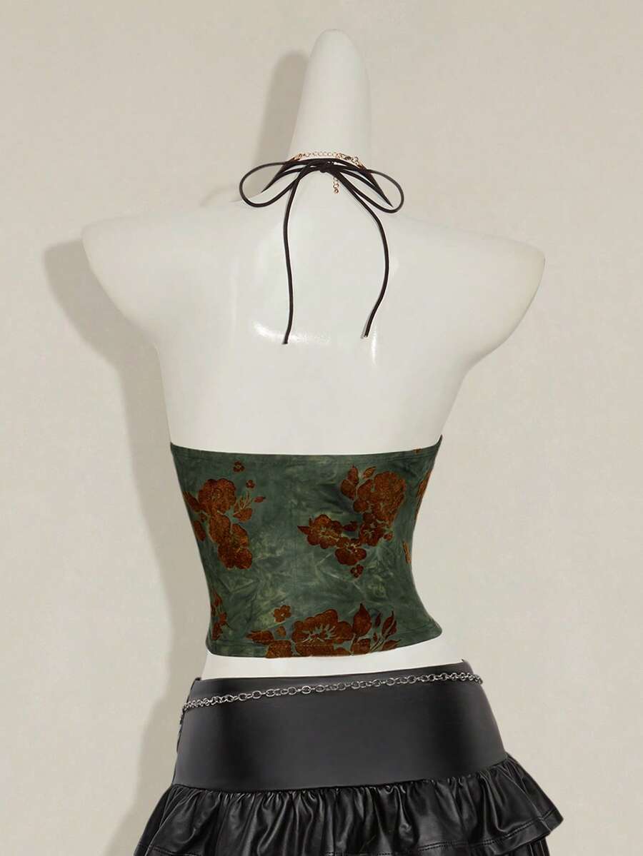 Women's green flocked jacquard halter tank top with plant pattern, criss-cross straps, deep V-back, knot detail, backless cut, and asymmetrical micro crop hem.