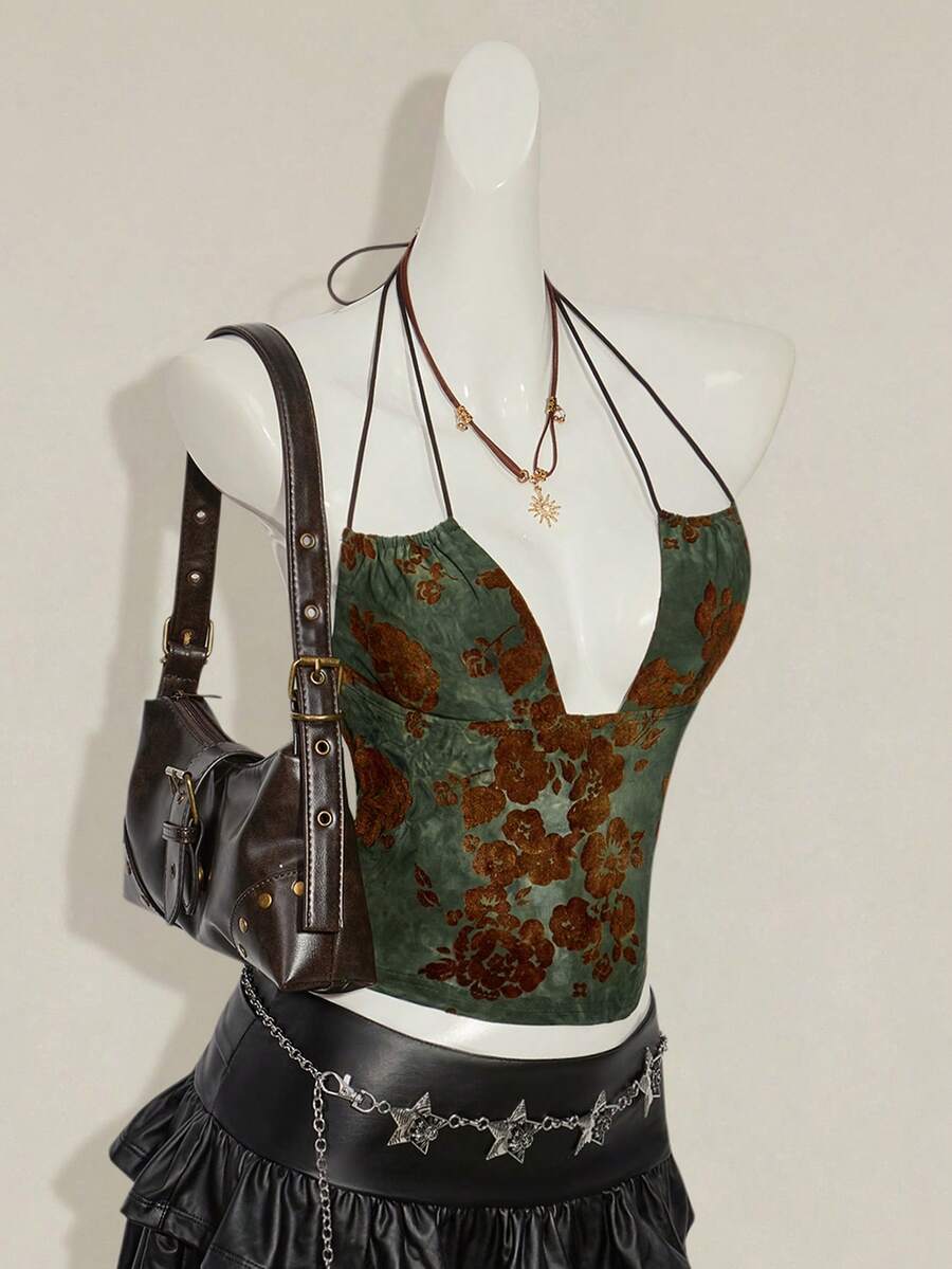 Women's green flocked jacquard halter tank top with plant pattern, criss-cross straps, deep V-back, knot detail, backless cut, and asymmetrical micro crop hem.