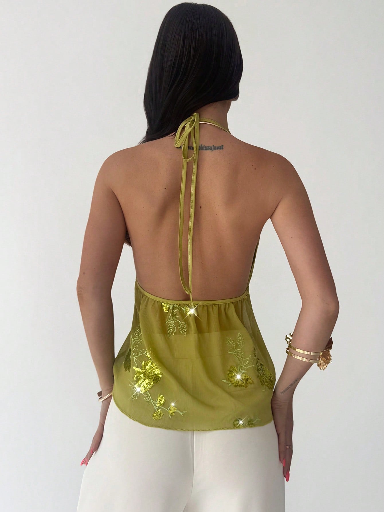Firerie women's green crop cami top with beaded floral embroidery, spaghetti straps, lace-up back, and flared hem